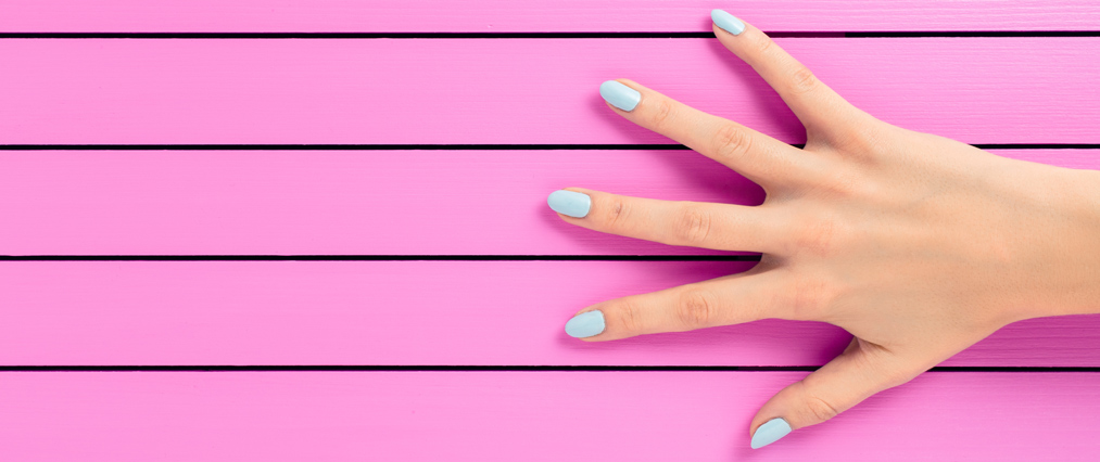 blue manicure pink background