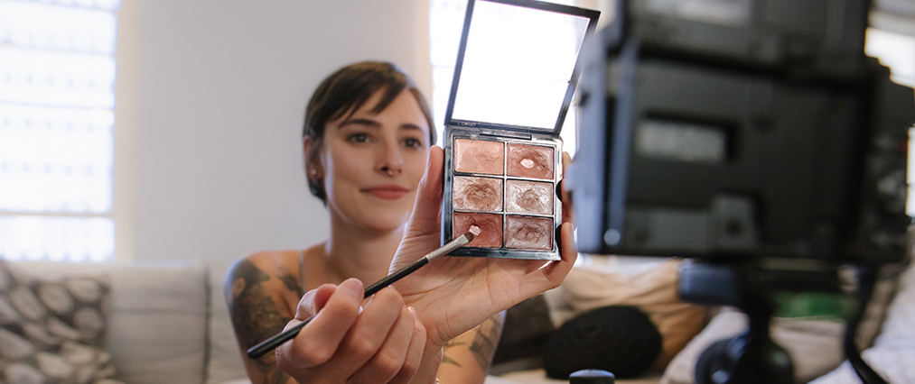applying makeup on camera
