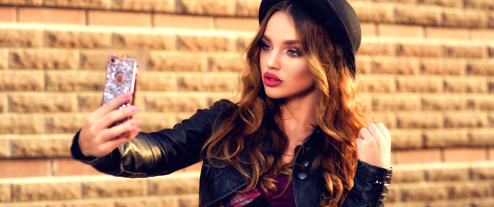 woman taking selfie outside