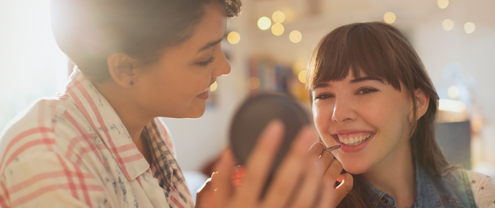 student applying makeup